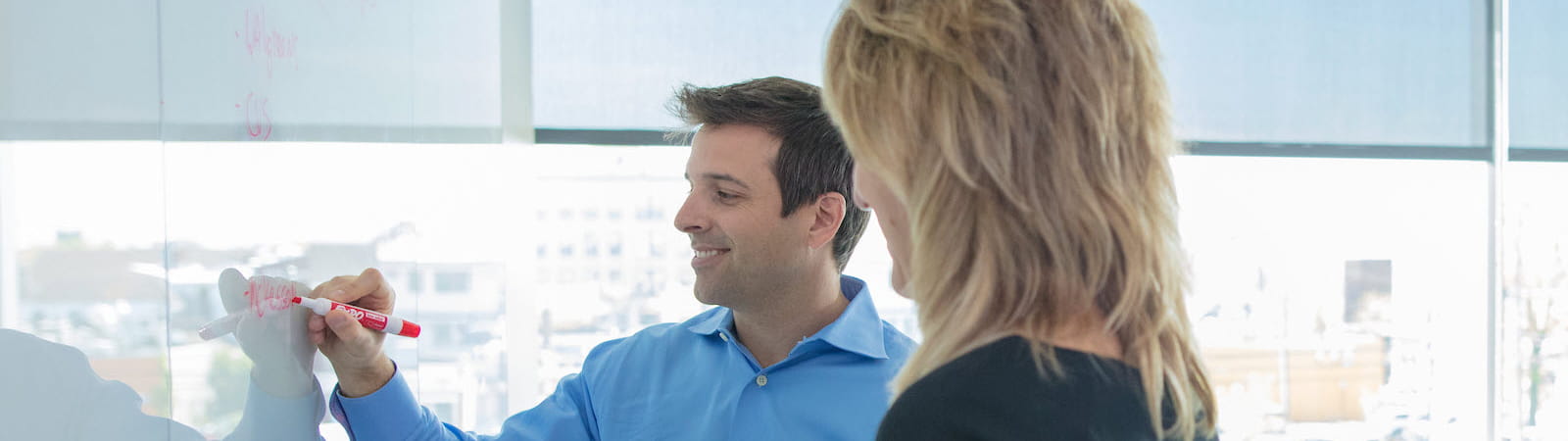 Team working on whiteboard