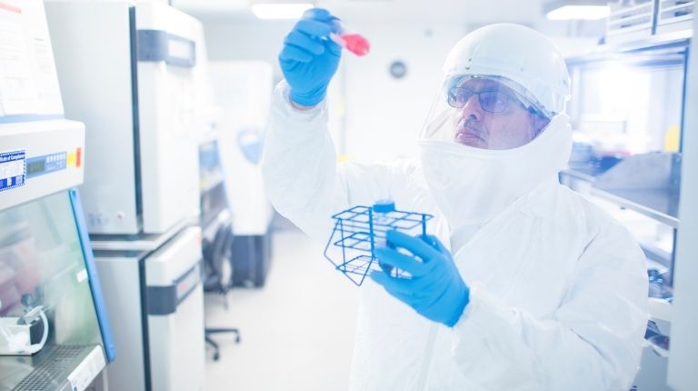 Giuseppe Palladino, Head of Serology Research, working with samples in BSL3 at Seqirus Research & Development facility in Cambridge, MA