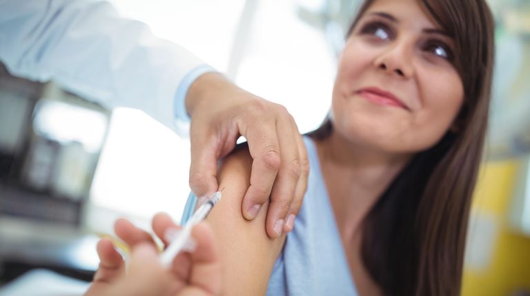 Doctor with Patient administering vaccine